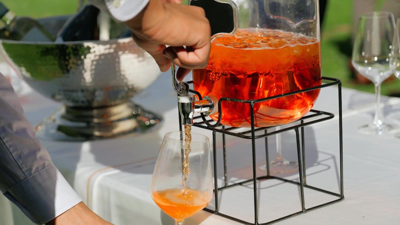 A drink poured from a glass dispenser